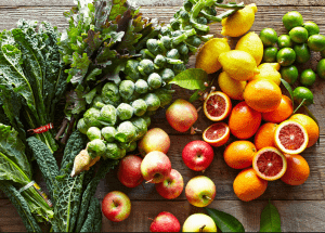 a group of fruits and vegetables on a wood surface Healthy Weight Loss Diets Herefordshire