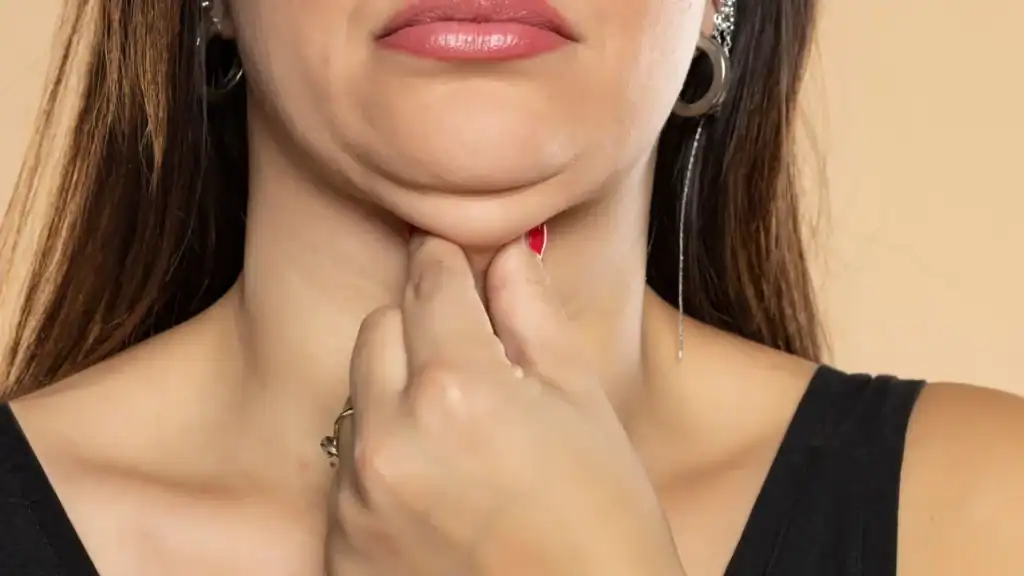 An image of a woman with double chin, sad, worried : Non Surgical Double Chin Removal Treatment in Herefordshire, UK